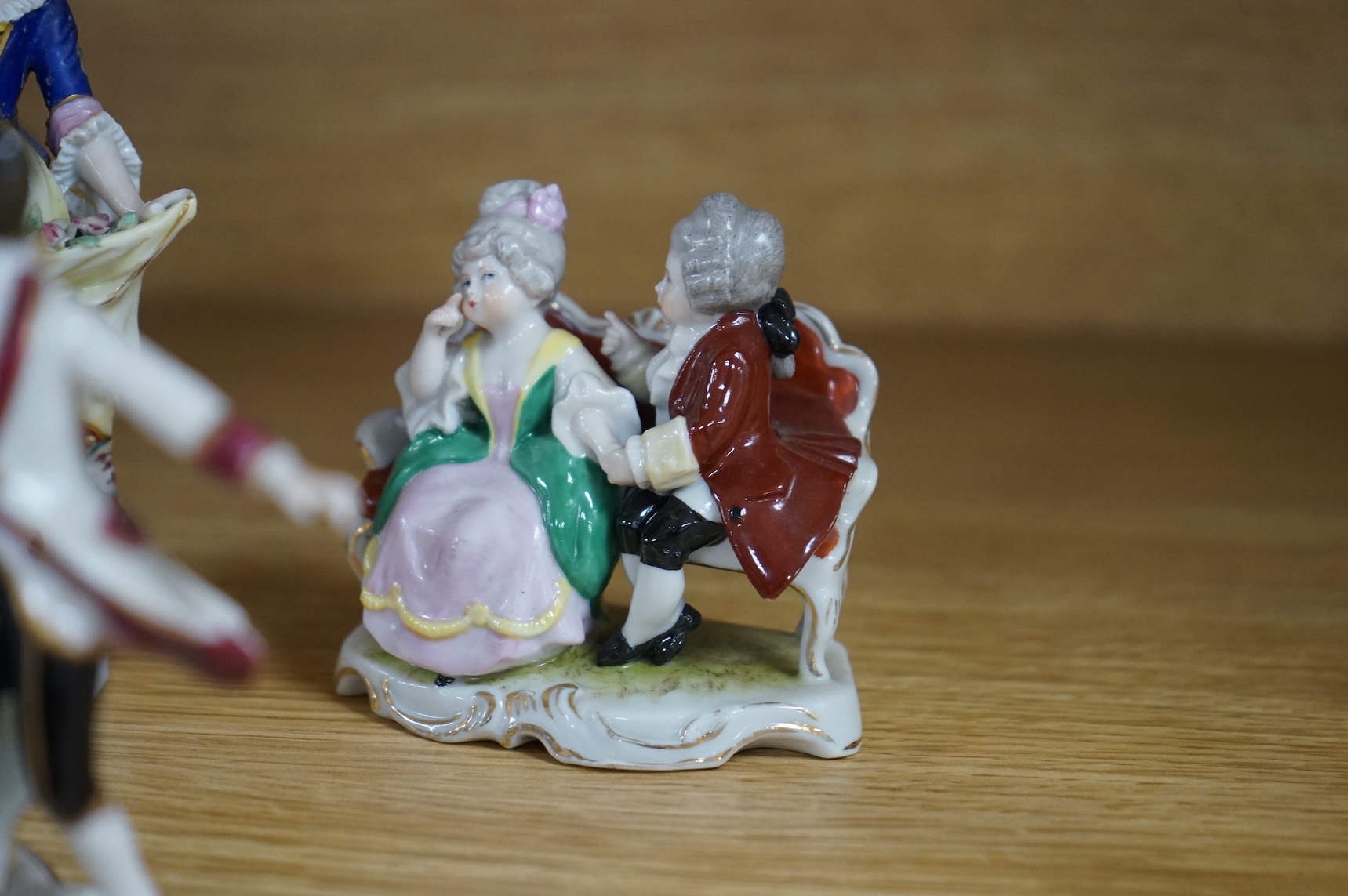 A collection of ten German and English porcelain figures and figure groups, mainly late 19th century, to include Dresden, largest 17cm high